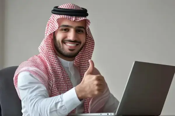 stock-photo-happy-saudi-man-sitting-his-desk-giving-thumbs-up_1151123-72418